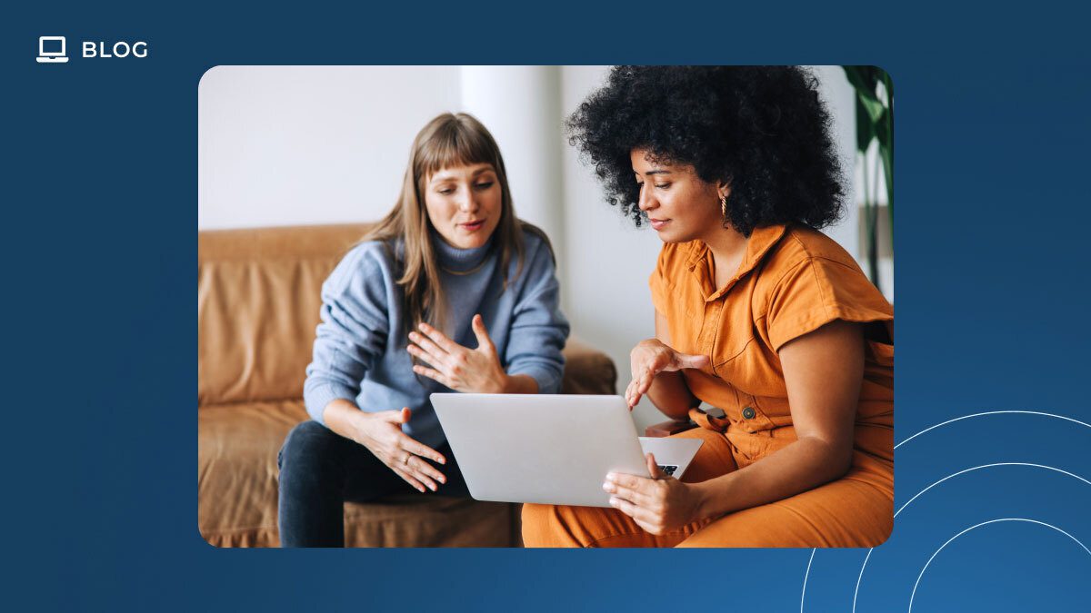 Two women sit on a couch looking at a laptop together, engaged in discussion about Customer Success. One wears a blue top and jeans, the other an orange outfit. The image features a blue border with “BLOG” and a computer icon in the top left corner.