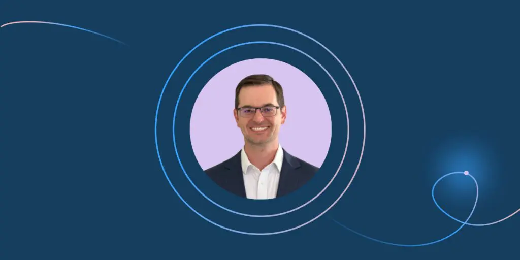 A smiling man in glasses and a suit is centered in a circular frame with blue and purple abstract rings, embodying the role of a Community Operator, set against a dark blue background infused with AI-inspired design elements.