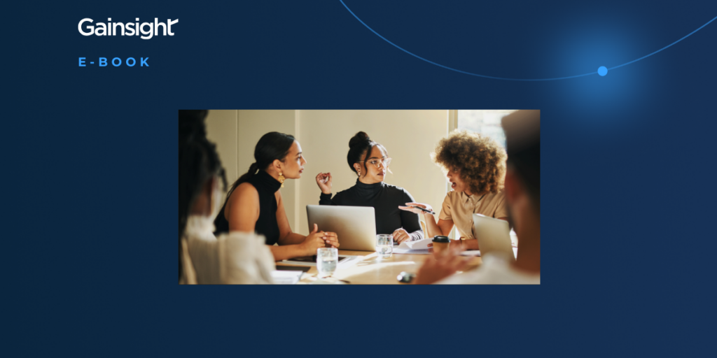 A group of four people sit around a table with laptops and papers, engaged in discussion. The image is framed by a blue background with the Gainsight logo and "E-BOOK" in the top left corner, highlighting a leadership playbook for next gen leaders.