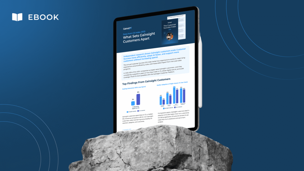 A digital tablet displays an eBook titled "What Sets Gainsight Customers Apart," featuring text and bar graphs. The tablet stands on a rock against a blue background with circular patterns, highlighting Customer Success and Scaling CS.