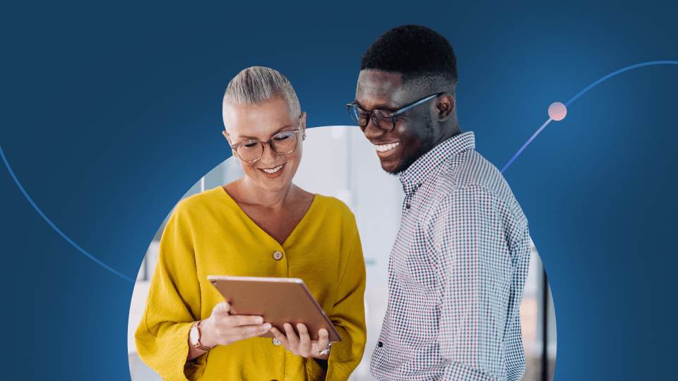 Two people stand together smiling while looking at a tablet, exploring retention intelligence. The woman wears a yellow top and glasses; the man has on a checked shirt and glasses. Abstract blue graphics decorate the background.