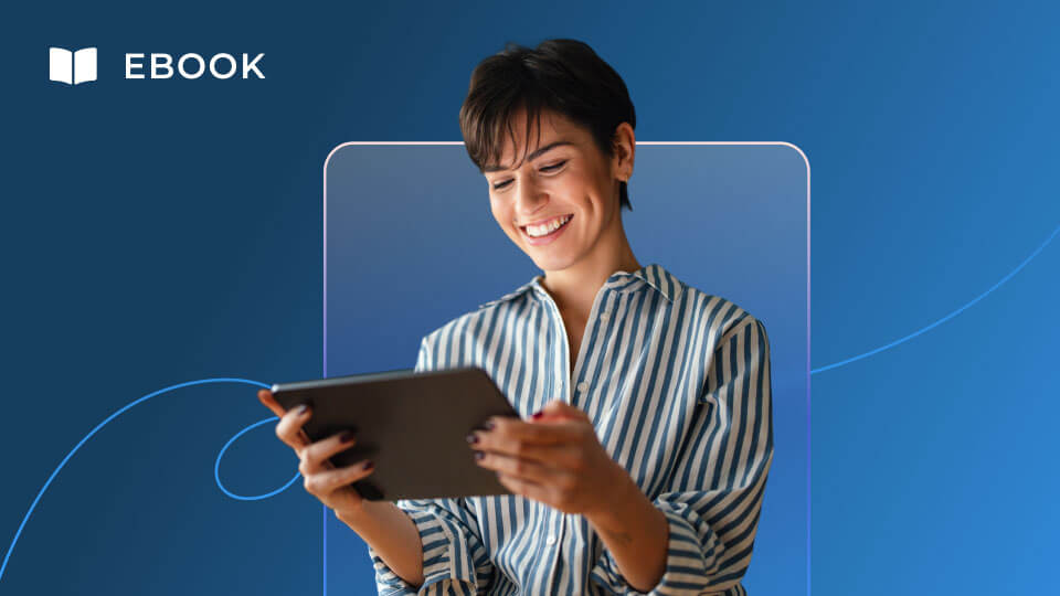 Smiling person in a striped shirt holds and looks at a tablet against a blue background with the word “EBOOK” and an open book icon in the corner, illustrating an Education Guide designed for AI Native Education Leaders.