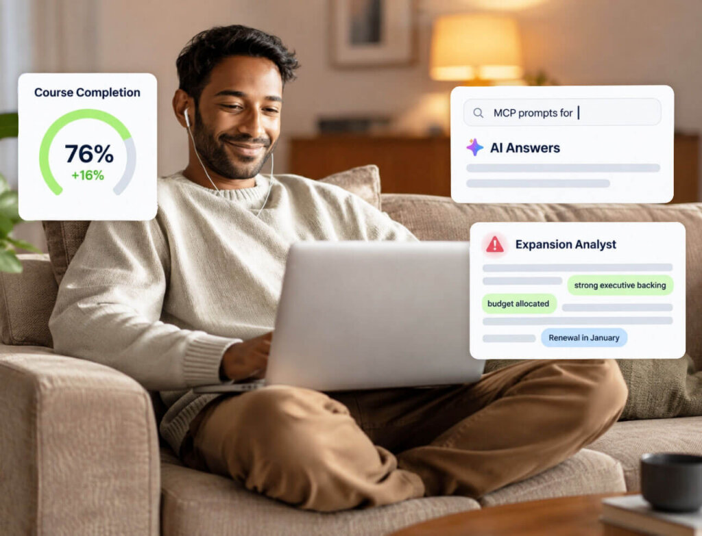 A man sits on a couch using a laptop, smiling with earphones in. On-screen graphics show course completion at 76%, AI answers, and tasks for an Expansion Analyst including budget and renewal updates.