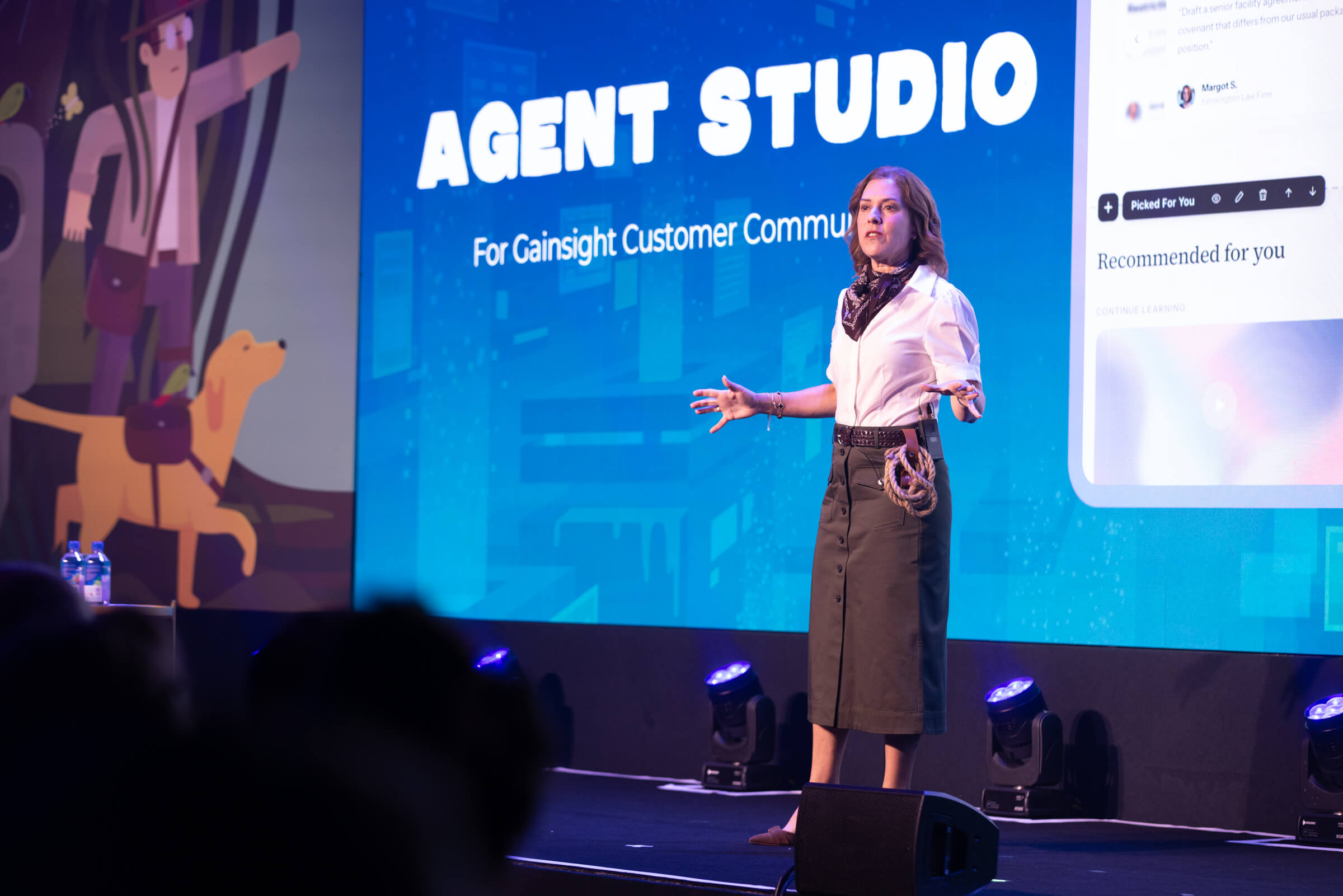 A speaker stands on stage at Pulse Europe 2026 in front of a large screen reading “Agent Studio for Gainsight Customer Community.”